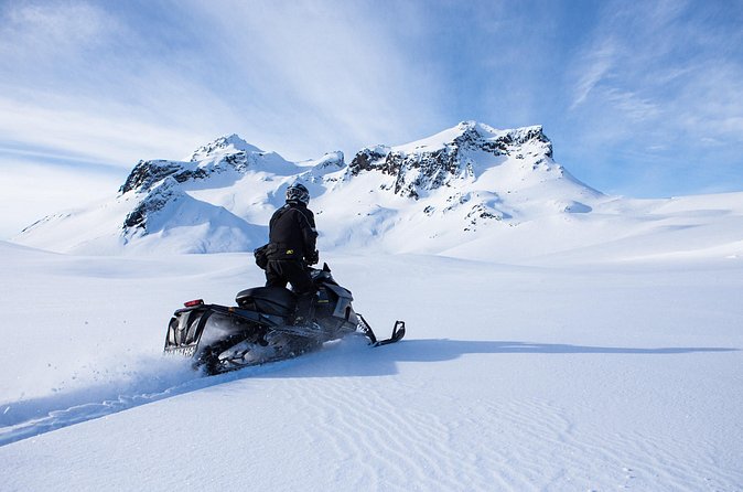 A solo rider on a performance snowmobile on Langjökull