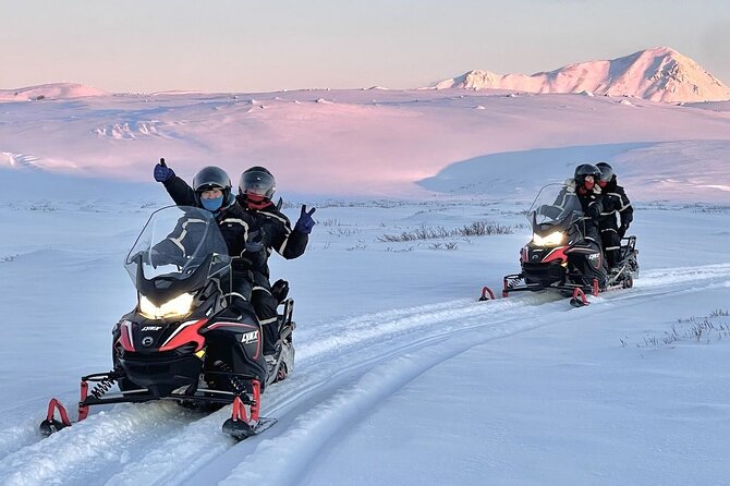 Snowmobilers in Mývatn’s snowy North Iceland landscape